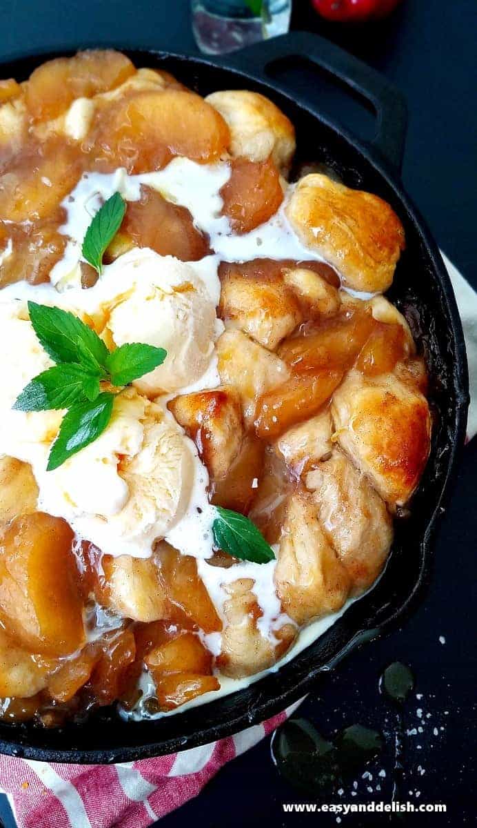 close up image showing apple pie cobbler with ice cream