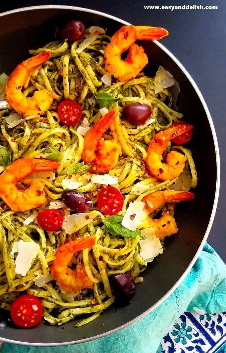 A skillet of kale pasta with shrimp