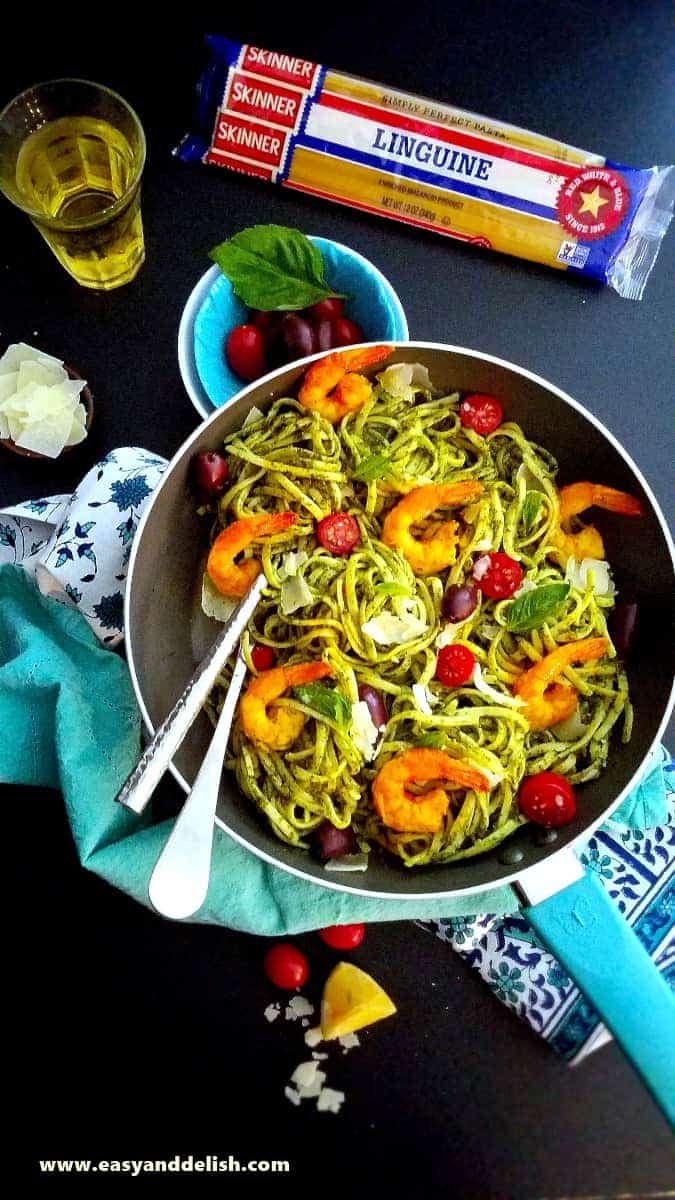 a skillet of kale pasta with shrimp and veggies