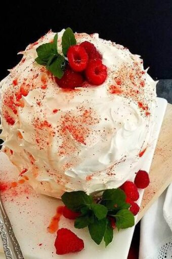 baked Alaska panettone on a platter with berries