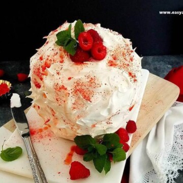 baked Alaska panettone on a platter with berries