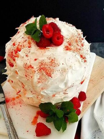 baked Alaska panettone on a platter with berries