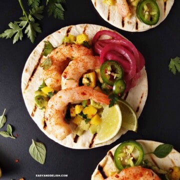 spicy shrimp tacos with flour tortillas and sides