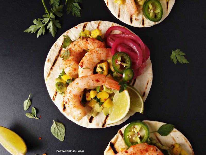 spicy shrimp tacos with flour tortillas and sides