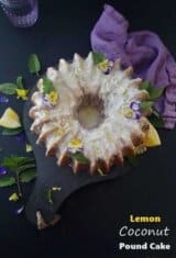 a whole lemon coconut pound cake garnished with fresh flowers on top.