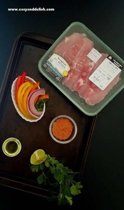 Ingredients of pork fajita bowl on a table