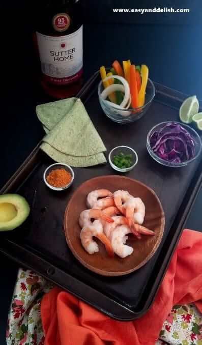 Ingredients of spicy taco shrimp fajitas on a table 