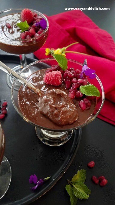 A glass with no-cook, vegan easy chocolate pudding.