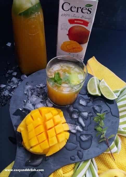 A glass of Mango Vodka Cocktail Drink and its ingredients