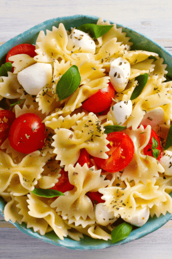 close up of caprese pasta salad with balsamic vinaigrette dressing..