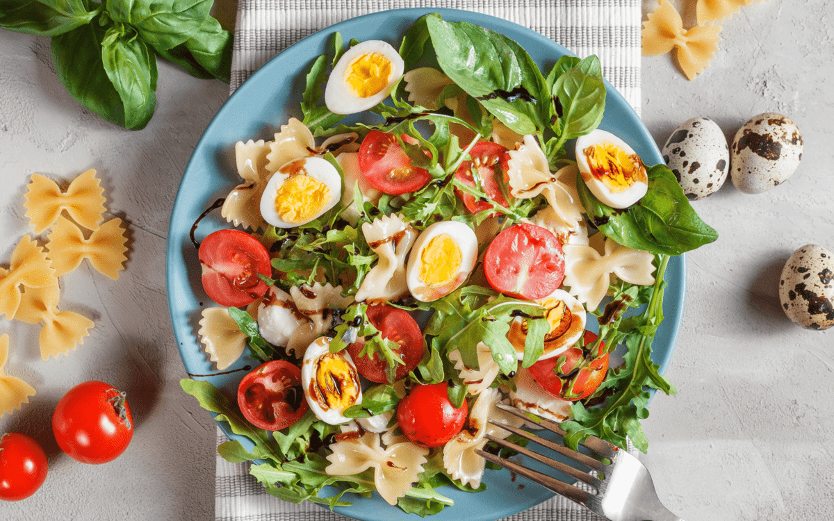 a variation of the dish with quail eggs and mixed greens.