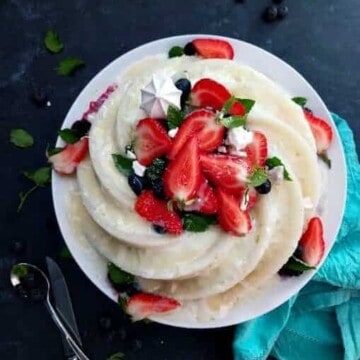 tapioca cake topped with berries in a plate