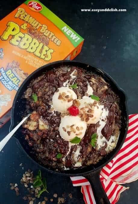 Peanut Butter Chocolate Banana Crumble Pie in a skillet with a box of cereal on the side