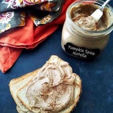 slices of bread with a spread of pumpkin spice Nutella with a jar on the background