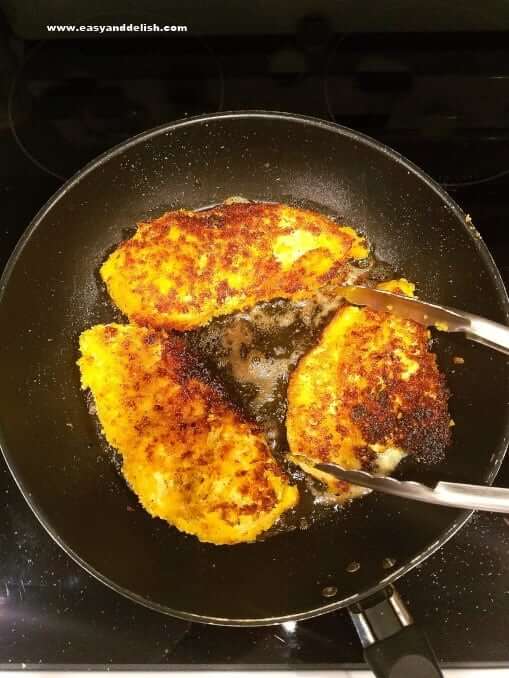 Turmeric lime chicken cooked in a skillet