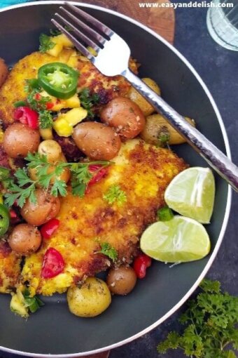 a skillet with turmeric lime chicken