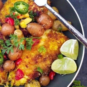 a skillet with turmeric lime chicken