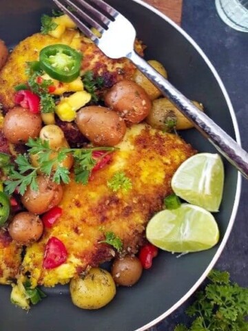 a skillet with turmeric lime chicken