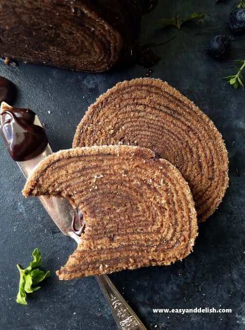 Two slices of 16-layer Brazilian chocolate cake roll on the table