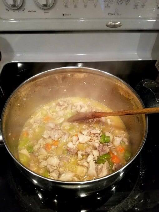 Preparing Mediterranean chicken pot pie -- cooking vegetables and chicken