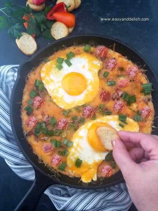 Loaded mashed potato skillet for breakfast with toasts on the side
