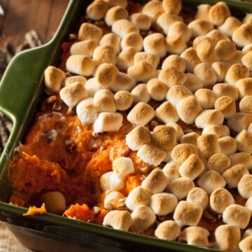 close up of sweet potato casserole with marshmallows and pecans.