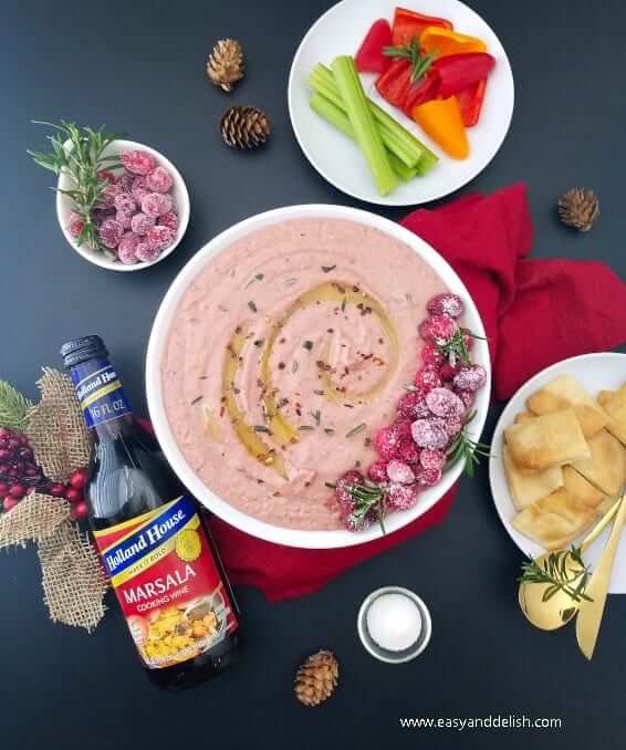 holiday appetizer in a bowl with vegetables on the side. 