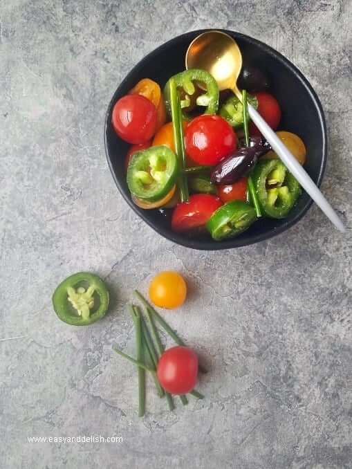 fresh vegetable salsa in a bowl to top baked cod in cheese sauce 