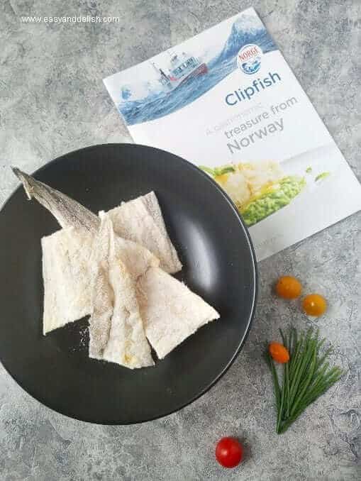 Salted fish fillets in a bowl.