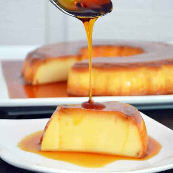 a slice of flan with a caramel drizzle
