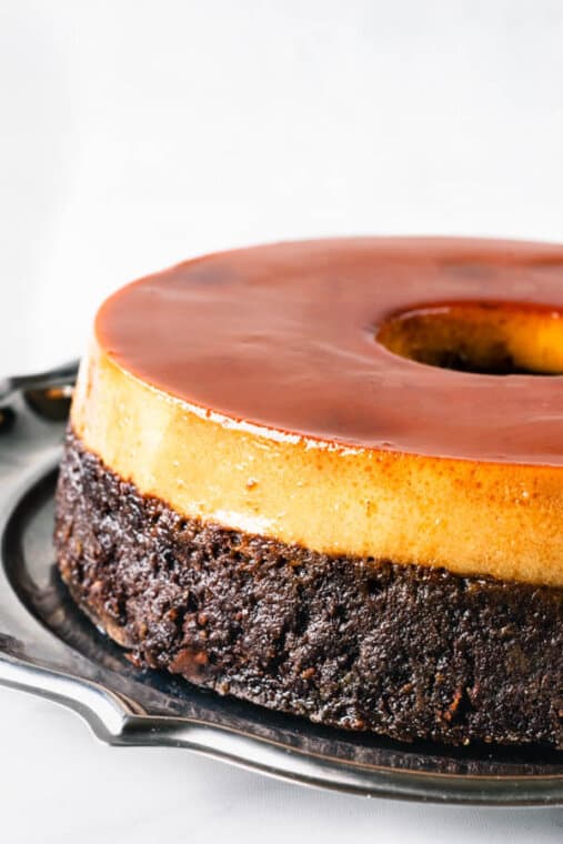 Flan cake served in a plate by Pies and Tacos