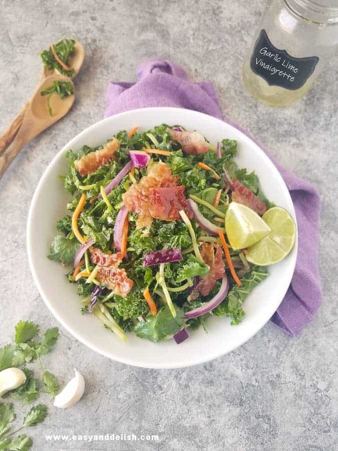 bowl of homemade coleslaw with dressing on the side