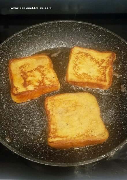 Cooking French toast in a large skillet.