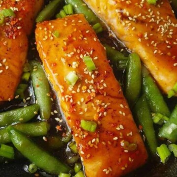close up of teriyaki salmon with sugar snap peas