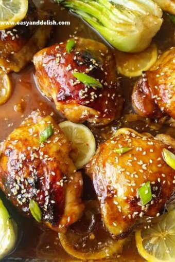 A close up of honey soy chicken with lemon slices