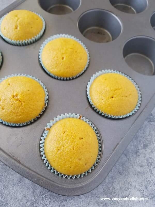 just baked carrot cupcakes in a muffin tin