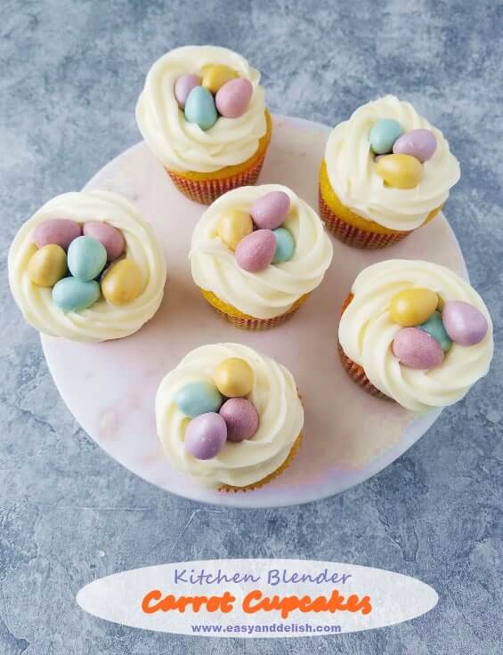 Six carrot cupcakes decorated for Easter in a platter