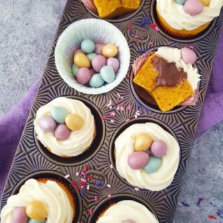 Brazilian carrot cupcakes decorated for Easter in a muffin tin
