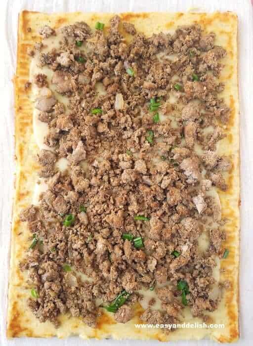 layering cheese and ground beef