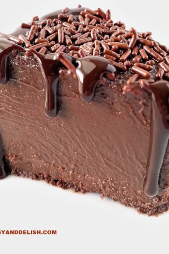 A close up of a slice of brigadeirao with chocolate sauce pouring from top to bottom