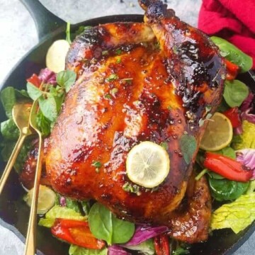 a skillet with roast chicken adobo