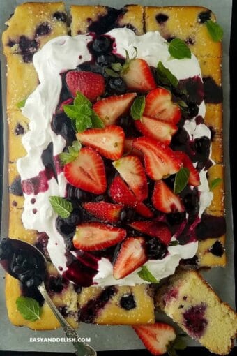 berry cake topped with fresh berries