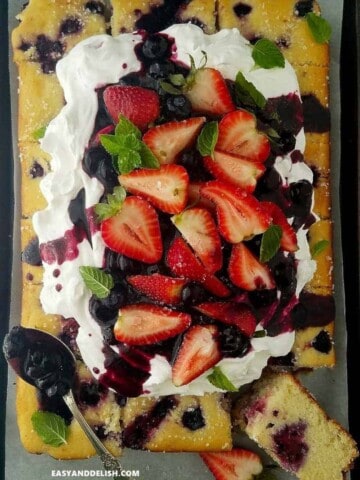 berry cake topped with fresh berries