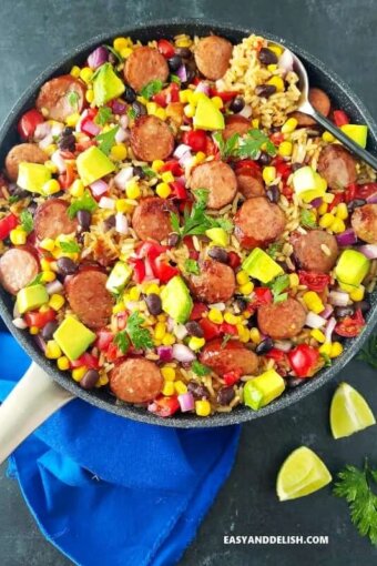 A pan with black bean and rice plus sausage and veggies