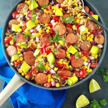 A pan with black bean and rice plus sausage and veggies