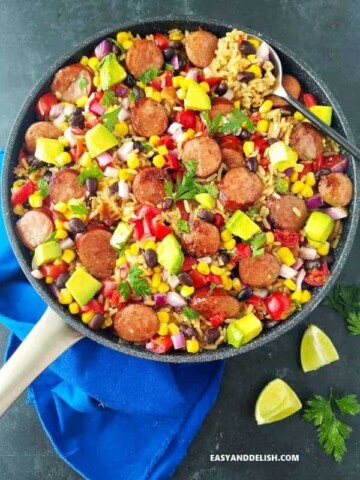 A pan with black bean and rice plus sausage and veggies