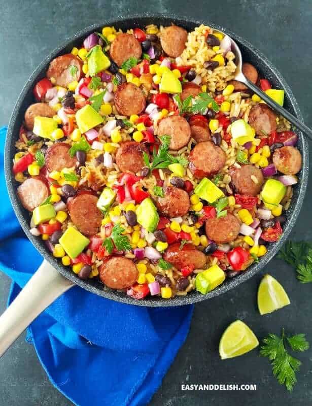 A pan with black bean and rice plus sausage and veggies