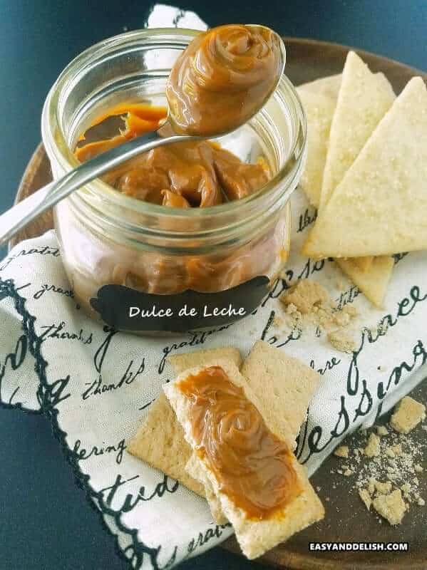 dessert in a mason jar with cookies on the side