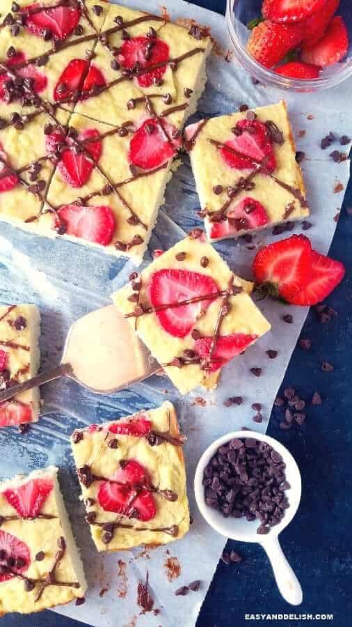 oven baked coconut flour pancakes sliced and served with strawberries and chocolate