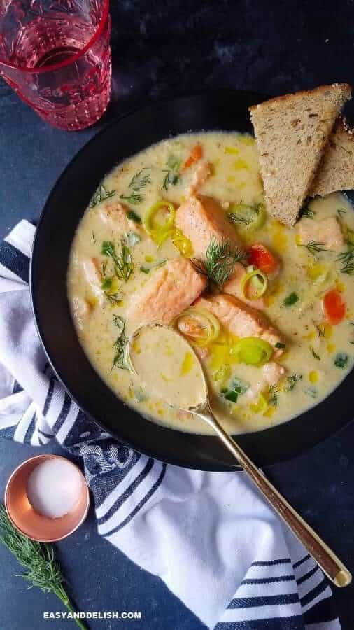 fish soup in a bowl served with bread